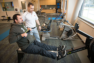 Patient with spine physical therapist